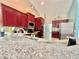Elegant kitchen with cherry cabinets, stainless steel appliances, and a granite countertop at 12450 Greco Dr, Orlando, FL 32824