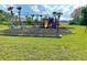 Well-equipped community playground with slides, swings, and play structures for enjoyment at 12450 Greco Dr, Orlando, FL 32824
