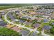 Aerial view of a residential neighborhood featuring neatly arranged houses with lush greenery at 152 Moscato Dr, Davenport, FL 33897
