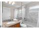 Bathroom with a granite vanity, shower/tub combo, and natural light at 152 Moscato Dr, Davenport, FL 33897