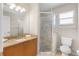 Full bathroom with vanity, granite countertop, and a tiled walk-in shower at 152 Moscato Dr, Davenport, FL 33897