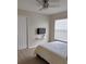Neutral bedroom with ceiling fan, closet, and a tv for relaxing evenings at 152 Moscato Dr, Davenport, FL 33897