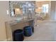Foyer featuring stylish console table with a mirrored frame and barstool seating visible in the dining area at 152 Moscato Dr, Davenport, FL 33897