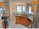 Modern kitchen with granite counters, stainless steel appliances, and adjacent dining area at 152 Moscato Dr, Davenport, FL 33897