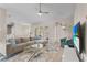 Bright and airy living room with neutral tones, ample seating, and a view of the pool area at 152 Moscato Dr, Davenport, FL 33897