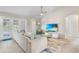 Comfortable living room with access to the pool, a ceiling fan, and neutral colors at 152 Moscato Dr, Davenport, FL 33897
