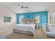 Main bedroom features a crib and accent wall with a ceiling fan, offering comfortable living at 152 Moscato Dr, Davenport, FL 33897