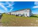 A spacious backyard with a well-maintained lawn, perfect for outdoor activities and relaxation at 1536 Mirabella Cir, Davenport, FL 33897