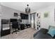 Bedroom features a large window and a modern light fixture, making it great as a home office or guest space at 1536 Mirabella Cir, Davenport, FL 33897