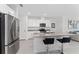 Bright kitchen features a breakfast bar island, stainless appliances, and modern finishes at 1536 Mirabella Cir, Davenport, FL 33897