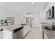 Well-equipped kitchen features an island, stainless appliances, and ample counter space at 1536 Mirabella Cir, Davenport, FL 33897