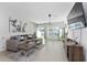 Open-concept living room features tile floors, modern decor, and ample natural light at 1536 Mirabella Cir, Davenport, FL 33897