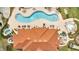 Overhead view showcases community pool, wading pool, and clubhouse with an orange tile roof at 1787 Coriander Dr, Kissimmee, FL 34759