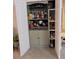 Charming bar area featuring glass shelving, wine storage, and stylish cabinetry for entertaining at 17880 Passionflower Cir, Clermont, FL 34714
