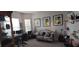 Inviting living room with natural light, decor, and comfortable seating; great for relaxing or entertaining at 17880 Passionflower Cir, Clermont, FL 34714