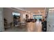 Open concept living room with a cozy seating area and sliding glass doors to the outdoor space at 17880 Passionflower Cir, Clermont, FL 34714
