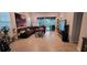 Spacious living room with tile flooring, comfortable sofa, and a view of the outdoor patio at 17880 Passionflower Cir, Clermont, FL 34714