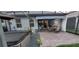 View of outdoor patio with retractable awning, dining area, and hot tub at 17880 Passionflower Cir, Clermont, FL 34714