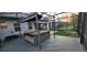 Spacious screened-in patio features a hot tub and shaded awning for relaxation at 17880 Passionflower Cir, Clermont, FL 34714