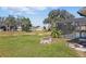 Backyard with a fire pit, pond, and a screened-in pool, perfect for entertaining at 1916 Nicholas Pl, St Cloud, FL 34771