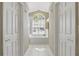 Bright bathroom featuring a soaking tub under a large window and tile flooring at 1916 Nicholas Pl, St Cloud, FL 34771