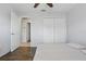 Simple bedroom with laminate flooring, a closet, and an entry door at 1916 Nicholas Pl, St Cloud, FL 34771
