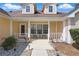 Cozy front porch with seating and charming decor, creating a welcoming entrance at 1916 Nicholas Pl, St Cloud, FL 34771