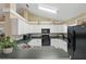 Functional kitchen featuring white cabinets, ample counter space, and modern appliances at 1916 Nicholas Pl, St Cloud, FL 34771