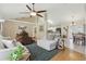 Open-concept living space with hardwood floors and views into the dining and kitchen areas at 1916 Nicholas Pl, St Cloud, FL 34771