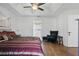 Well-lit main bedroom with trey ceilings, seating area, and private entry to the bathroom at 1916 Nicholas Pl, St Cloud, FL 34771