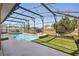 Screened-in pool with a lounging area, perfect for enjoying the outdoors at 1916 Nicholas Pl, St Cloud, FL 34771