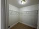 Walk-in closet with built-in wire shelving for ample storage space at 1937 Barksdale Dr, Orlando, FL 32822