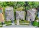 Aerial view of the home's roof, landscaping, and proximity to neighboring properties at 2165 The Oaks Blvd, Kissimmee, FL 34746