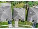 Aerial view of the home's roof, landscaping, and proximity to neighboring properties at 2165 The Oaks Blvd, Kissimmee, FL 34746
