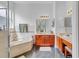 Spacious bathroom features a soaking tub, separate vanities, and tile flooring at 2165 The Oaks Blvd, Kissimmee, FL 34746