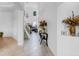 Hallway view showcasing tile floors, staircase, and high ceilings with chandelier at 2165 The Oaks Blvd, Kissimmee, FL 34746