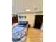 Well-lit bedroom features a large bed, wardrobe, and laminate flooring at 2320 Amherst Ave, Orlando, FL 32804