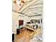 Cozy bedroom with wood floors, exposed ceiling beams, and built-in shelving at 2320 Amherst Ave, Orlando, FL 32804