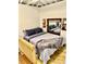 Bedroom featuring a plush bed with gray and blue accents and built in shelving at 2320 Amherst Ave, Orlando, FL 32804