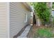 Exterior view of a gray home with a walkway and mature trees at 2320 Amherst Ave, Orlando, FL 32804