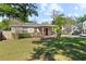 Beautiful home boasts a well-kept lawn, established landscaping, and a welcoming porch at 2320 Amherst Ave, Orlando, FL 32804