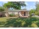 Charming home featuring a cozy porch, well-maintained lawn, and mature trees at 2320 Amherst Ave, Orlando, FL 32804