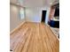 Bright living room featuring hardwood floors, recessed lighting, and access to the kitchen at 2320 Amherst Ave, Orlando, FL 32804