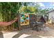 Outdoor patio with seating, hammock, and artistic mural on the privacy fence at 2320 Amherst Ave, Orlando, FL 32804