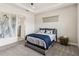Inviting bedroom with plush carpet, tray ceiling, and a comfortable bed with accent pillows at 2658 Meadowedge Loop, St Cloud, FL 34772