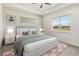 A bedroom is decorated with a bed and 2 side tables at 2658 Meadowedge Loop, St Cloud, FL 34772