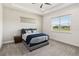 Bright bedroom with tray ceiling, plush carpet, and a cozy bed with stylish bedding at 2658 Meadowedge Loop, St Cloud, FL 34772