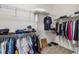Walk-in closet featuring ample storage with metal racks, perfect for organizing wardrobe items at 2658 Meadowedge Loop, St Cloud, FL 34772