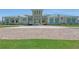 Attractive clubhouse exterior featuring stone accents, lush landscaping and a circular driveway at 2658 Meadowedge Loop, St Cloud, FL 34772