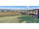 Scenic community lakeside pier with a dock and stunning water views beyond a fenced community area at 2658 Meadowedge Loop, St Cloud, FL 34772